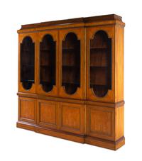 A Baker George III Style Satinwood and Fruitwood Breakfront Bookcase