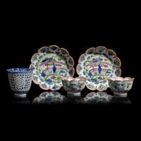 A Chinese Reticulated Blue and White Porcelain Wine Cup and Two Famille Verte Tea Bowls with Saucers, Kangxi Period 清康熙 青花酒杯及粉彩茶具一組