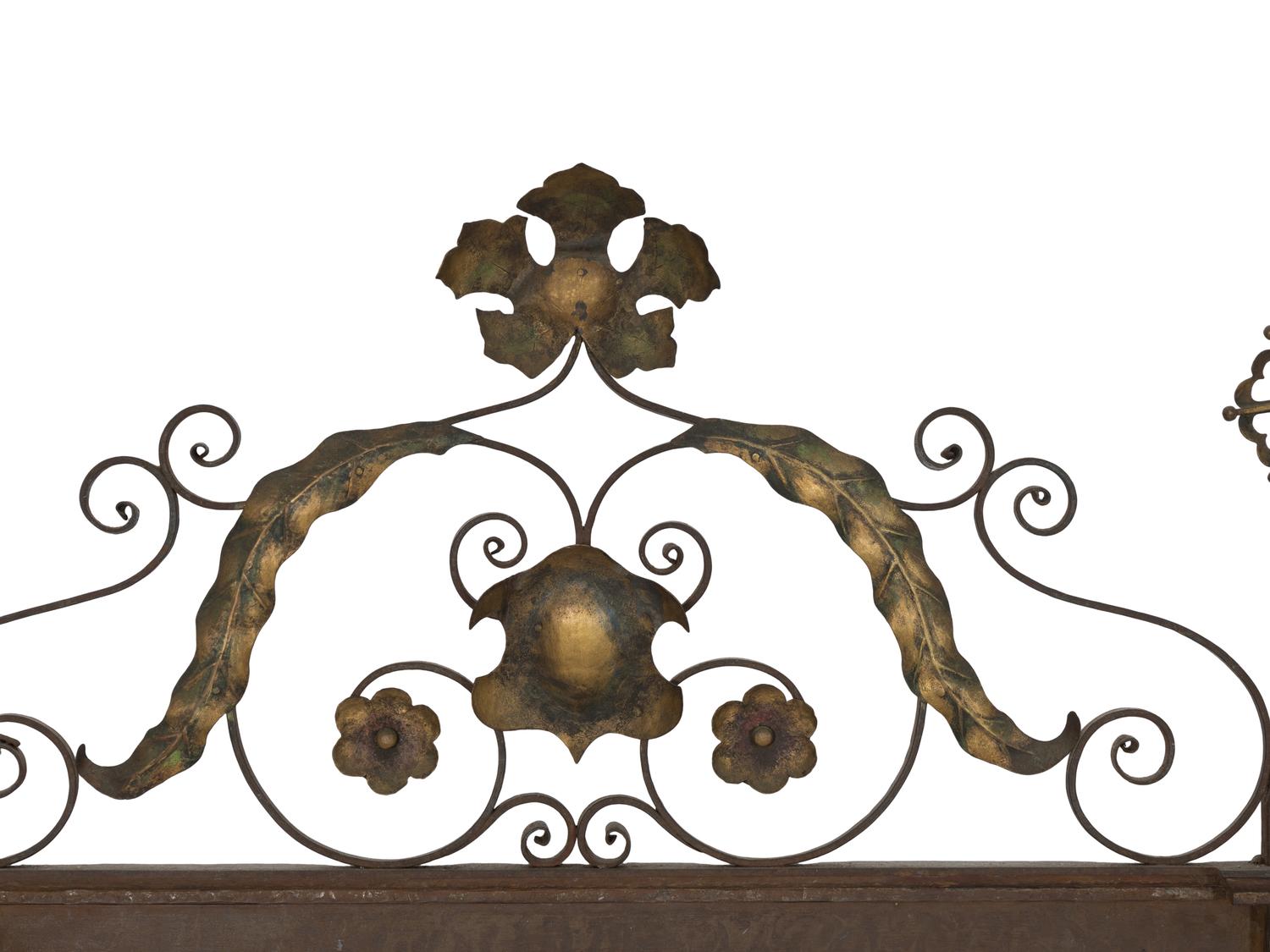 A Continental Patinated Iron and Gilt Tole Mirror