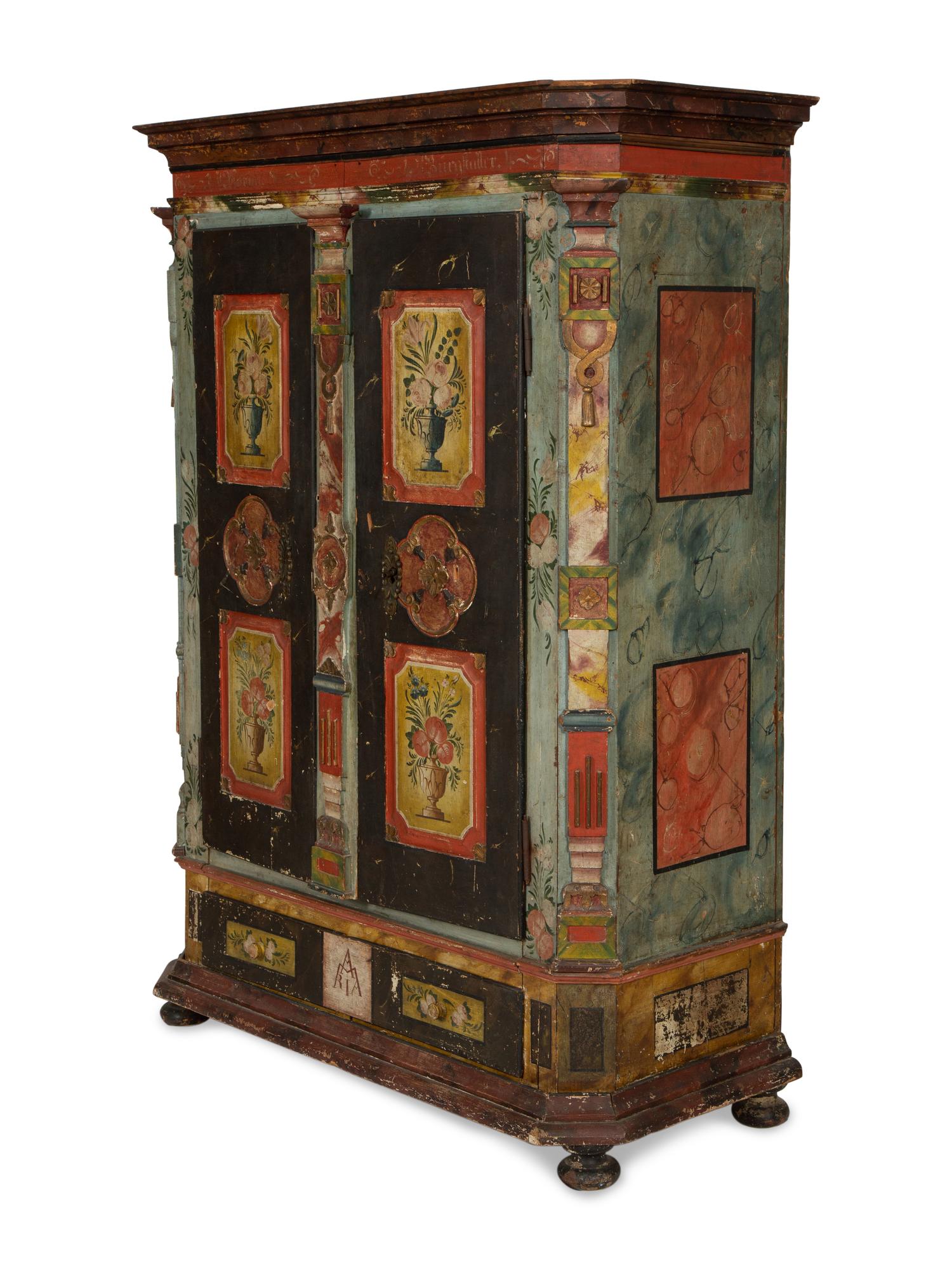 A Continental Carved, Painted and Parcel Gilt Pine Schrank
