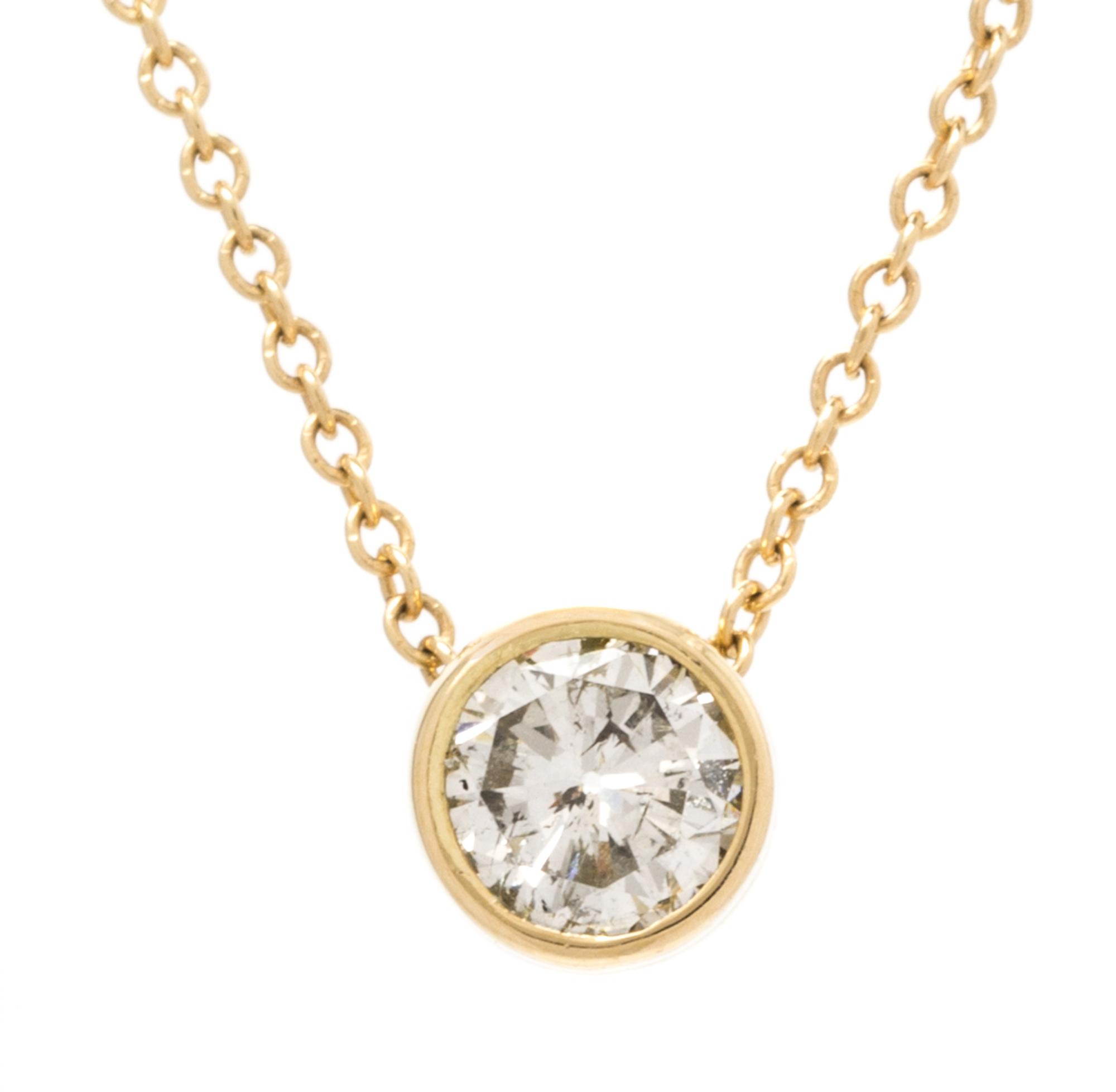 An 18 Karat Yellow Gold and Diamond Solitare Pendant, 1.60 dwts.