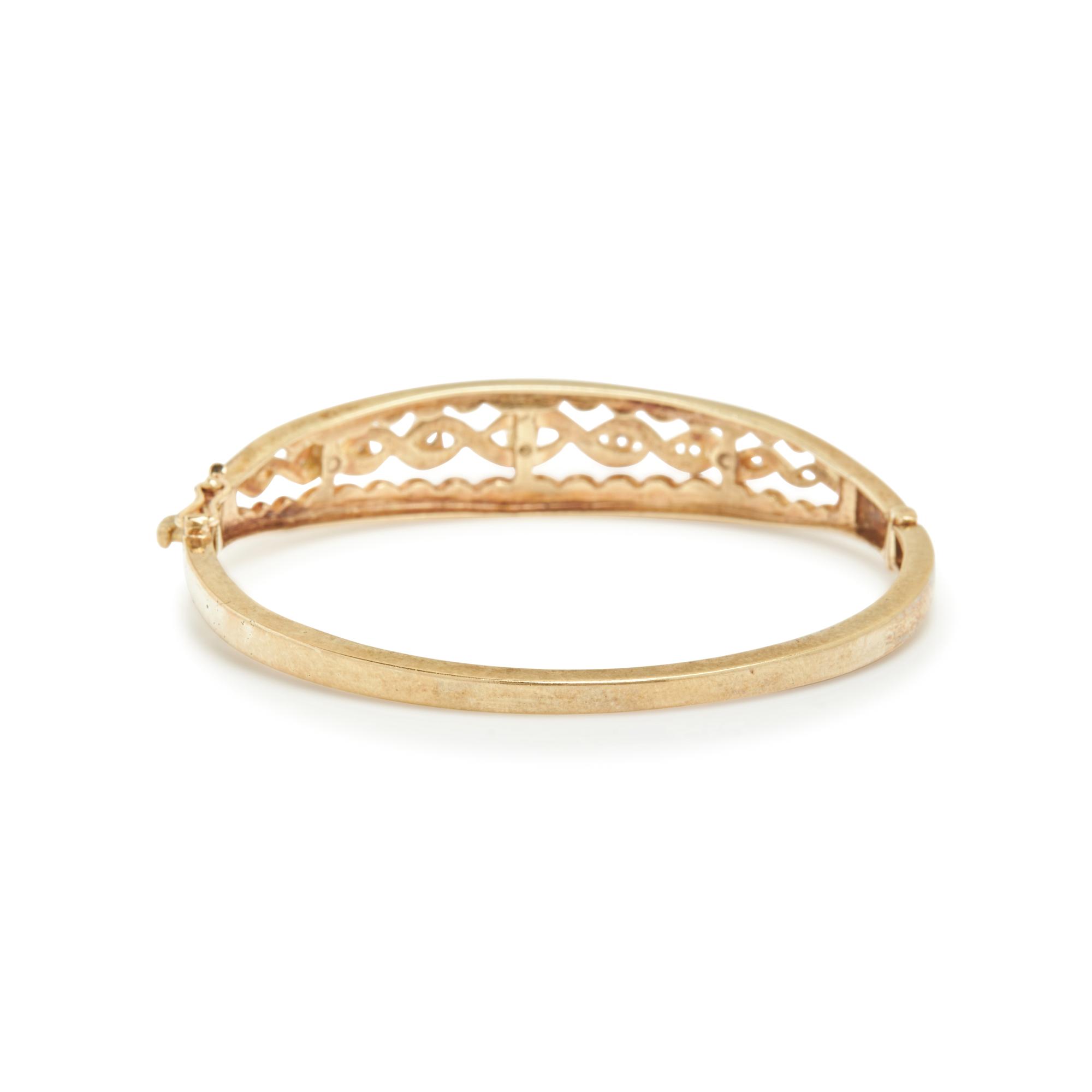 COLLECTION OF YELLOW GOLD AND DIAMOND BANGLE BRACELETS