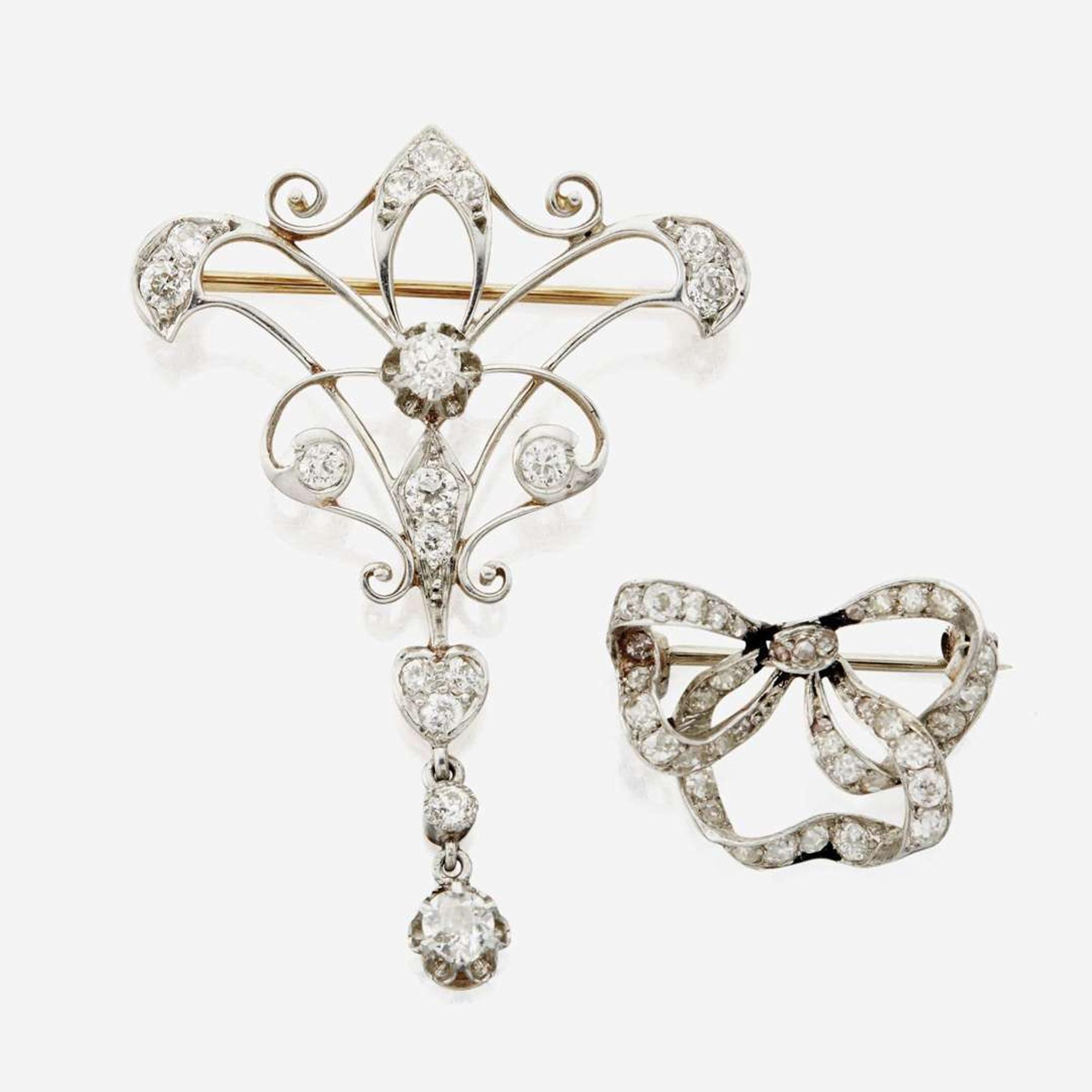 A collection of two antique diamond brooches