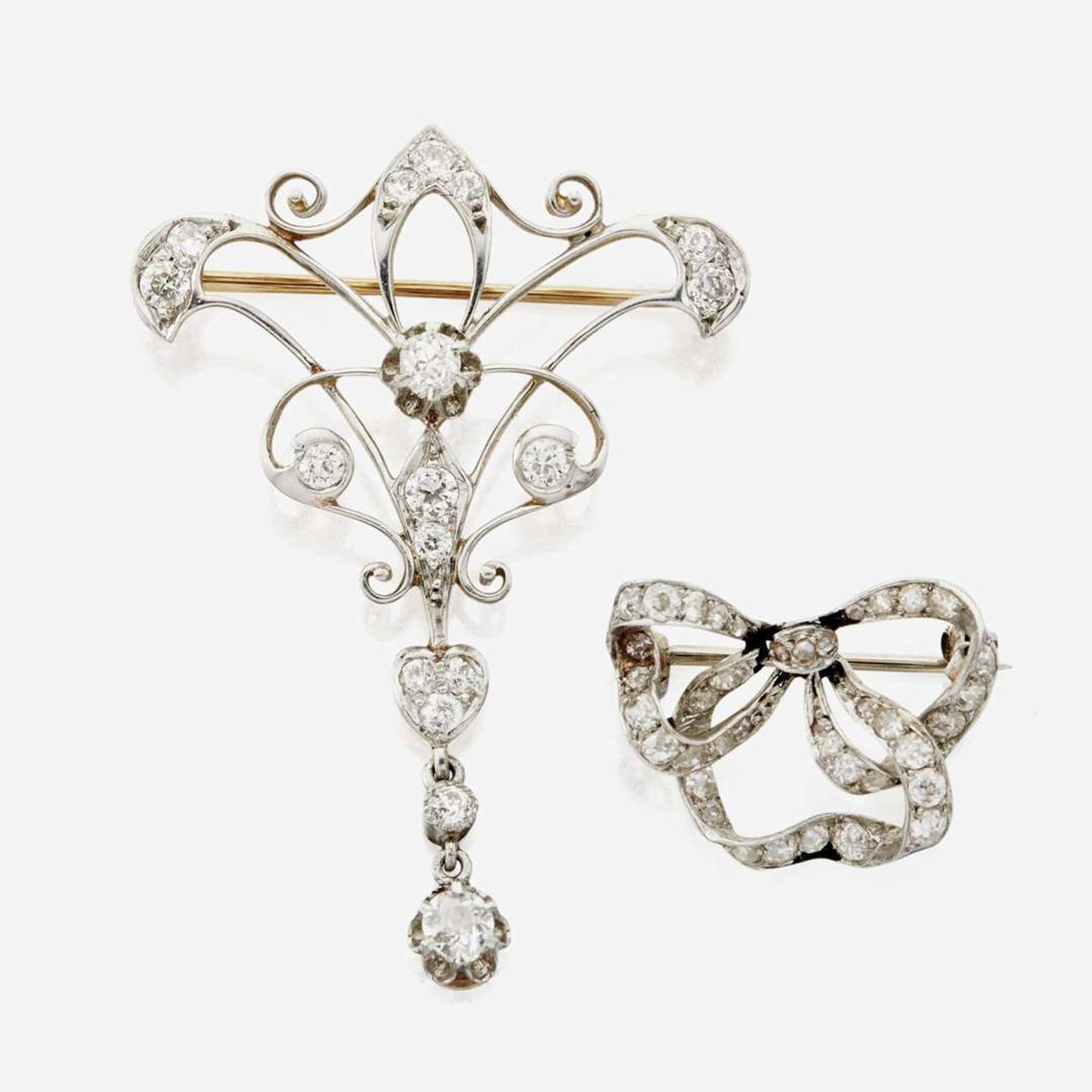 A collection of two antique diamond brooches