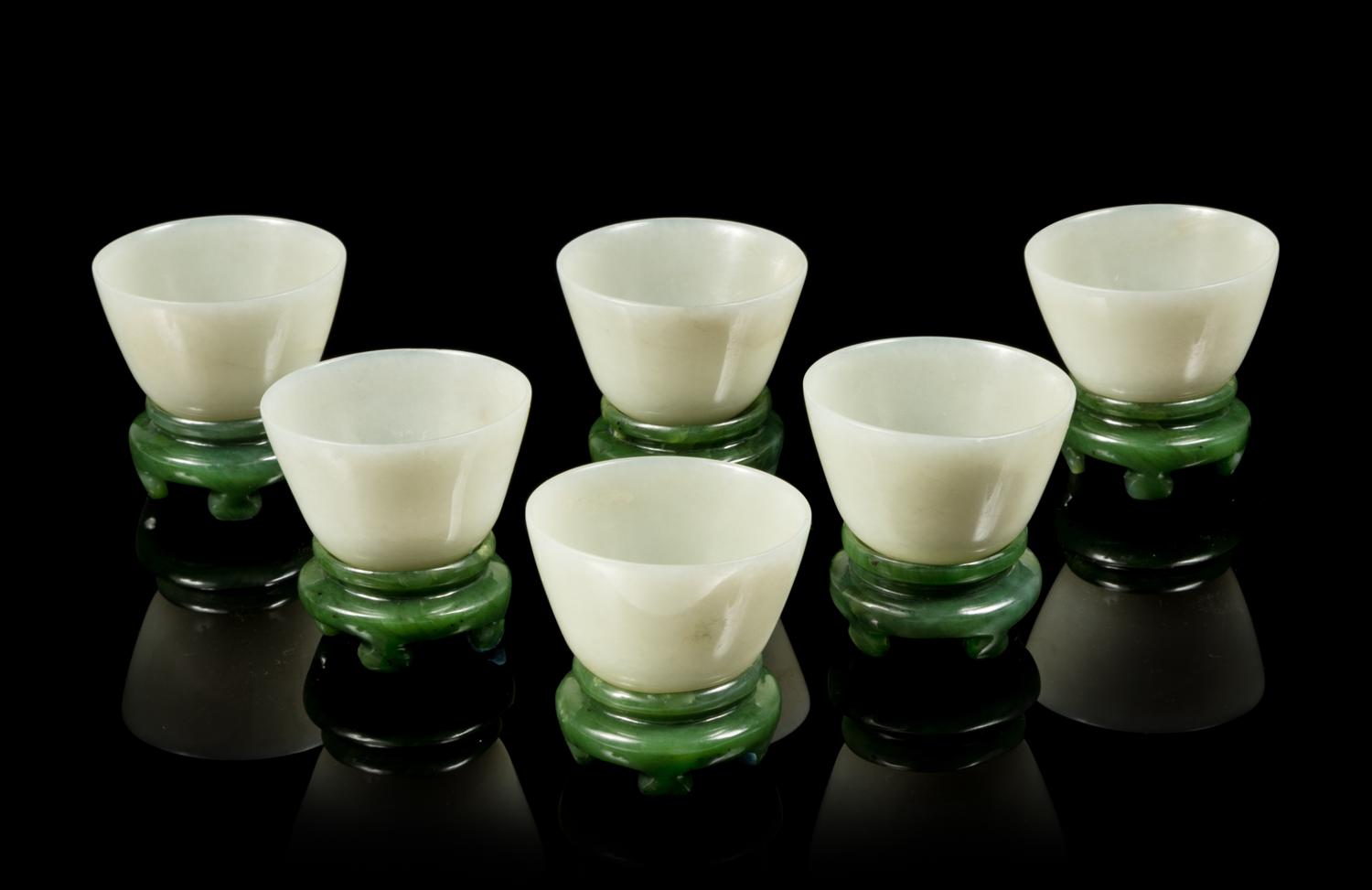 A Set of Six Celadon Jade Wine Cups and Stands Diameter of each 2 3/4 inches. — LATE QING DYNASTY