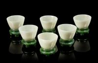 A Set of Six Celadon Jade Wine Cups and Stands Diameter of each 2 3/4 inches. — LATE QING DYNASTY
