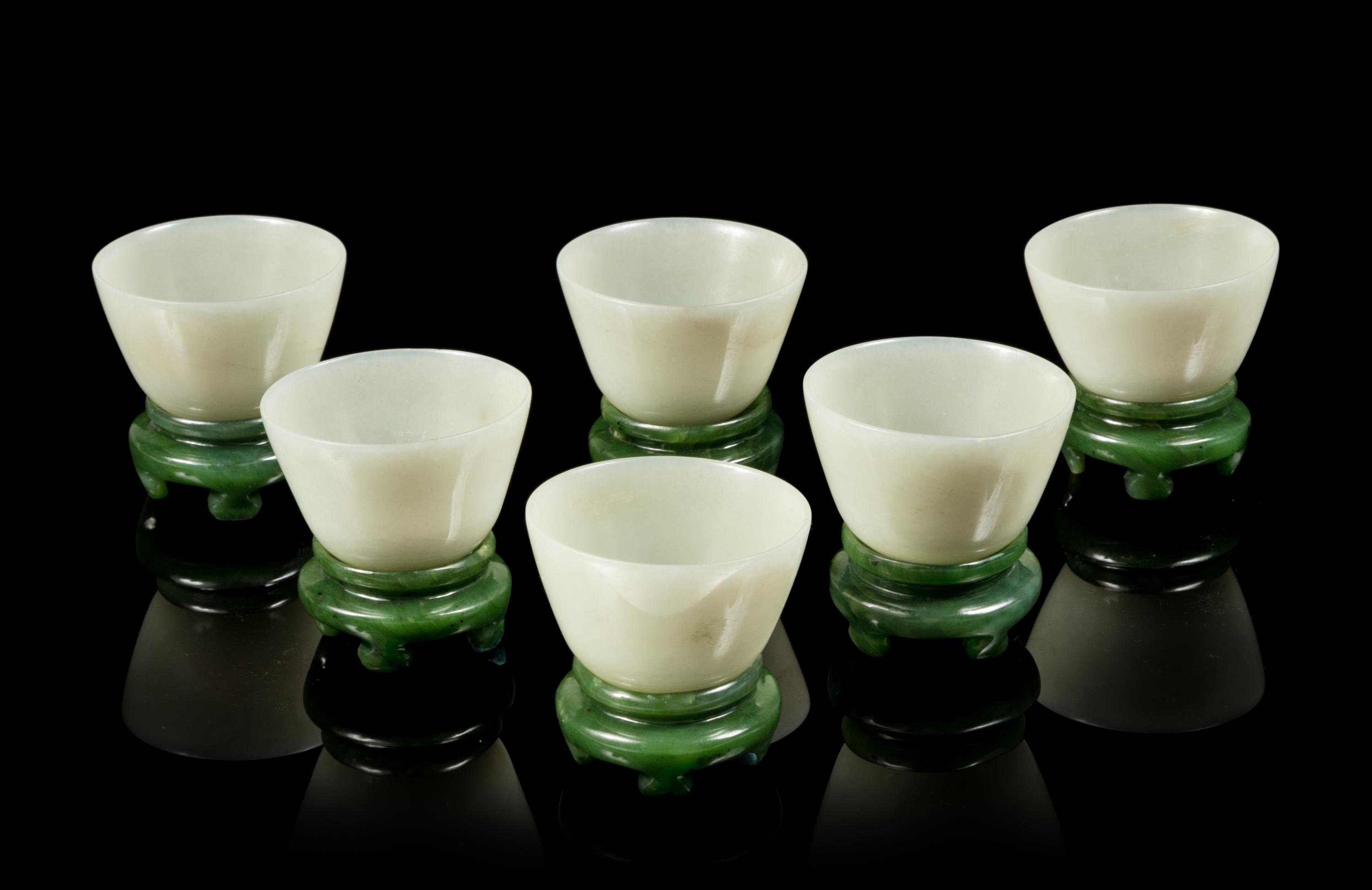 A Set of Six Celadon Jade Wine Cups and Stands Diameter of each 2 3/4 inches. — LATE QING DYNASTY