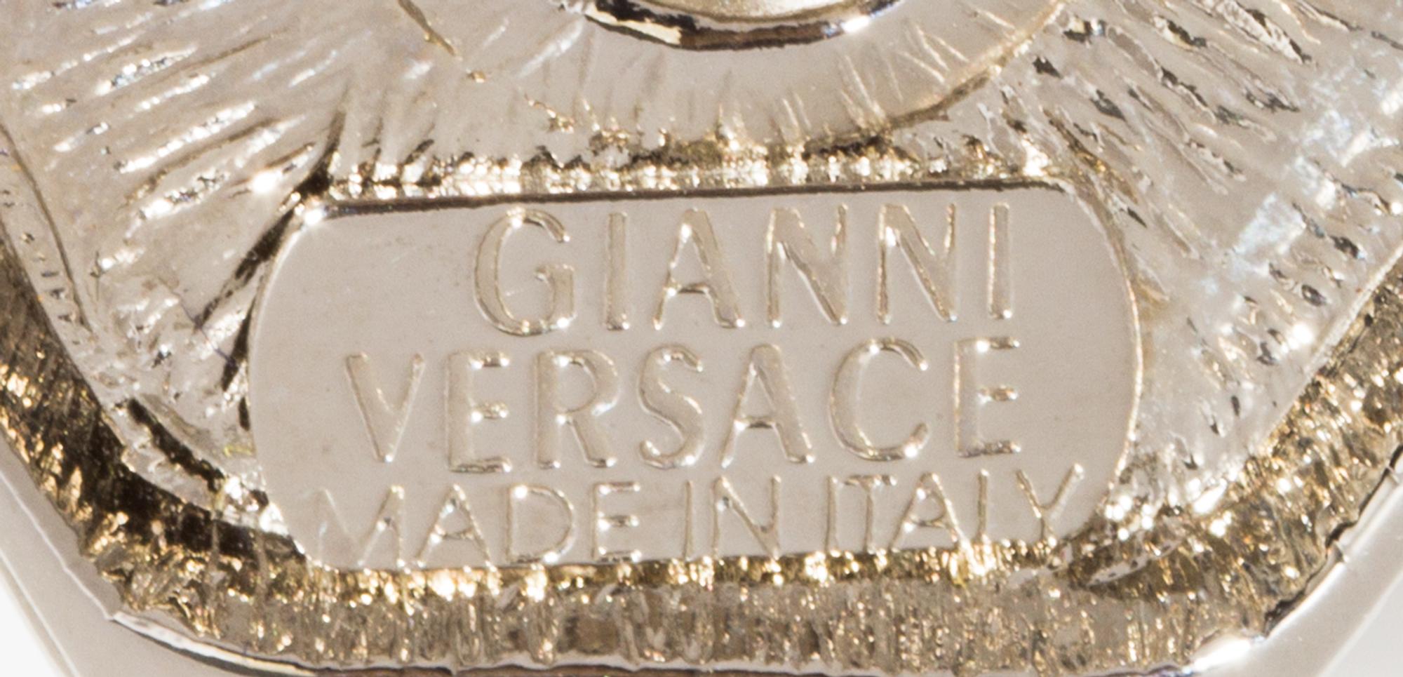 A Pair of Gianni Versace Bolt Earclips, 1.5" x 1.5".
