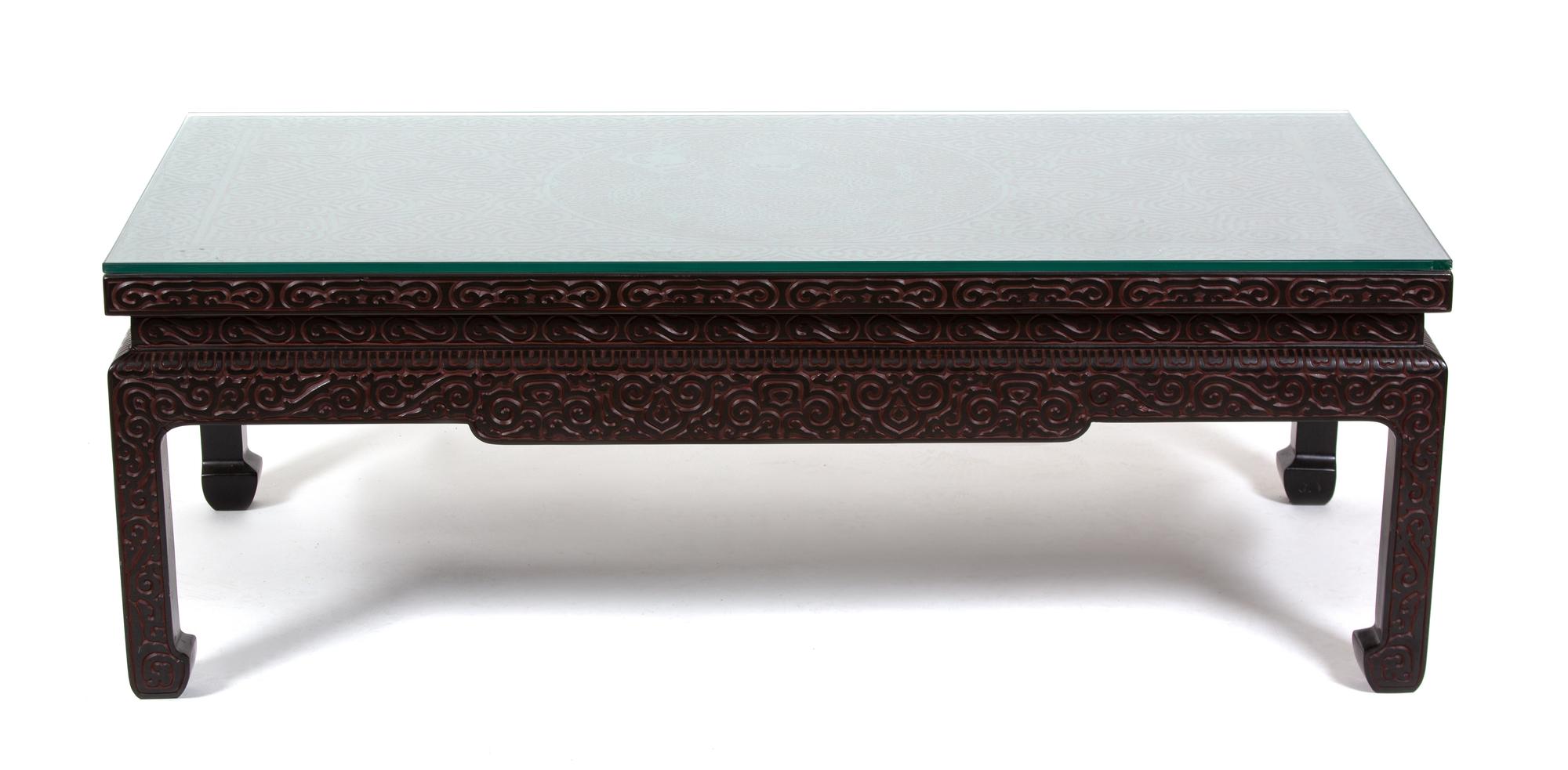 A Chinese Carved Black and Red Lacquer Low Coffee Table Height 16 x width 46 3/4 x depth 23 1/4 inches. — 20TH CENTURY
