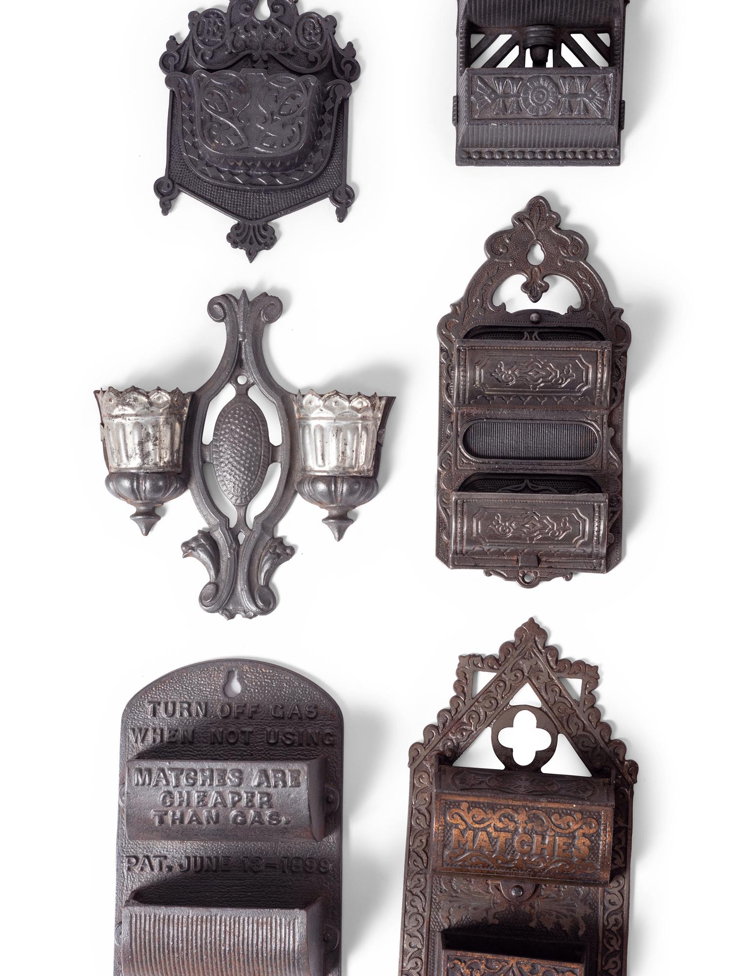 A Group of Cast Iron Hanging Match Holders