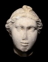 A Roman Marble Head of a Woman with Plaited Hair and Ribbon