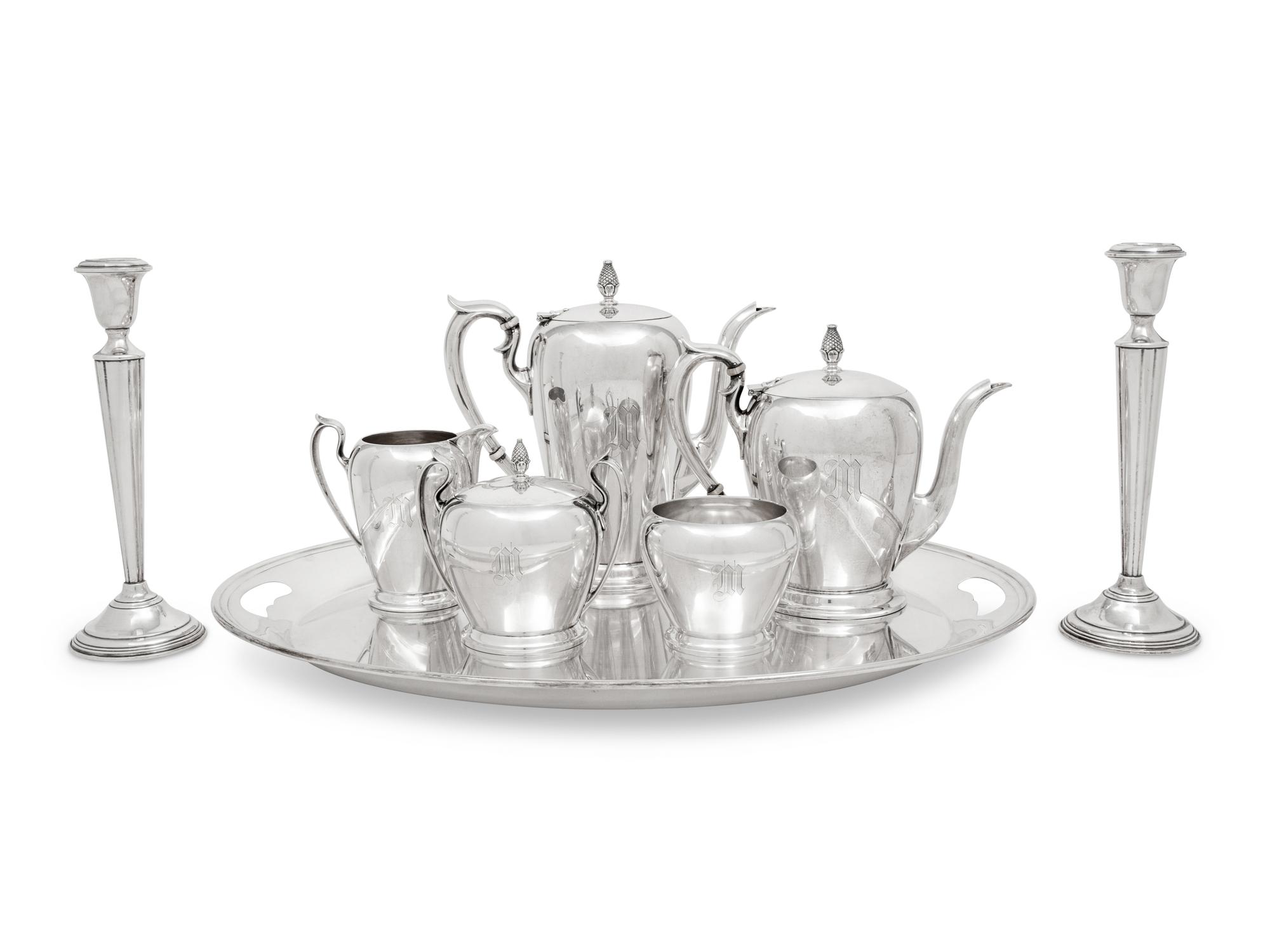 An American Silver Five-Piece Tea and Coffee Service and a Pair of Cartier Silver Candlesticks