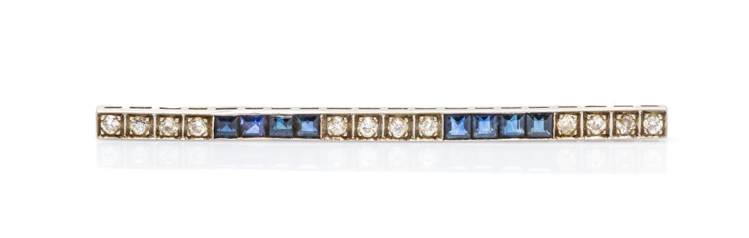 An Art Deco Platinum, Diamond and Sapphire Bar Brooch, 3.00 dwts.