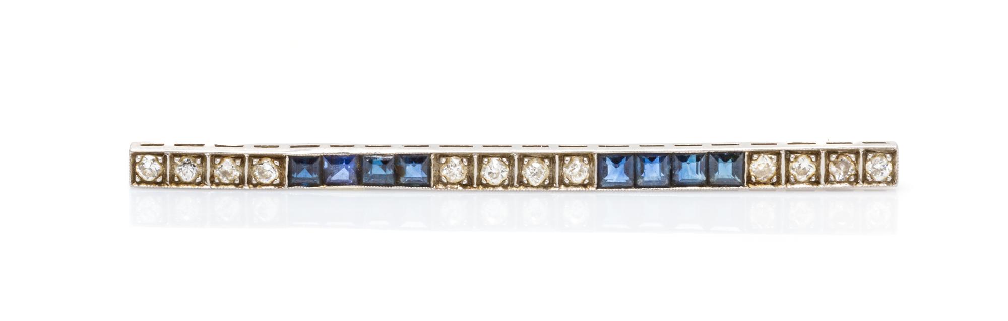 An Art Deco Platinum, Diamond and Sapphire Bar Brooch, 3.00 dwts.