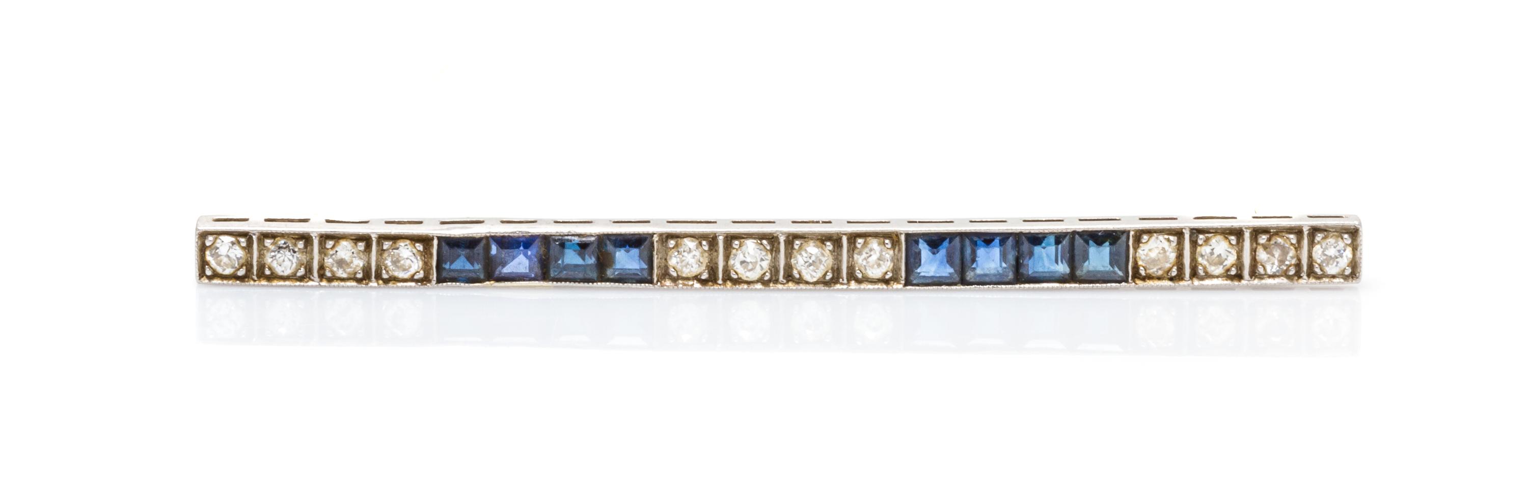 An Art Deco Platinum, Diamond and Sapphire Bar Brooch, 3.00 dwts.