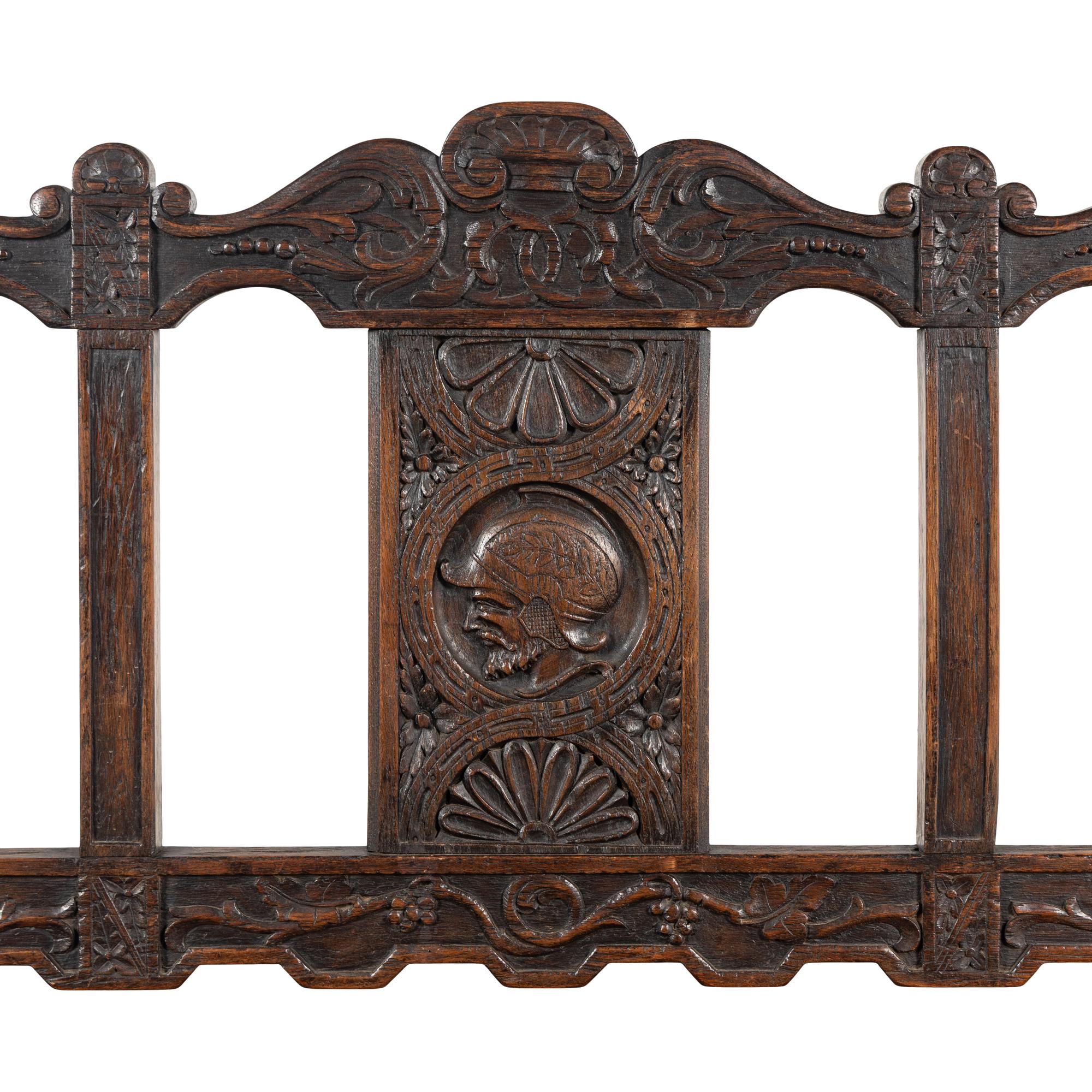 A Continental Carved Oak Hall Bench