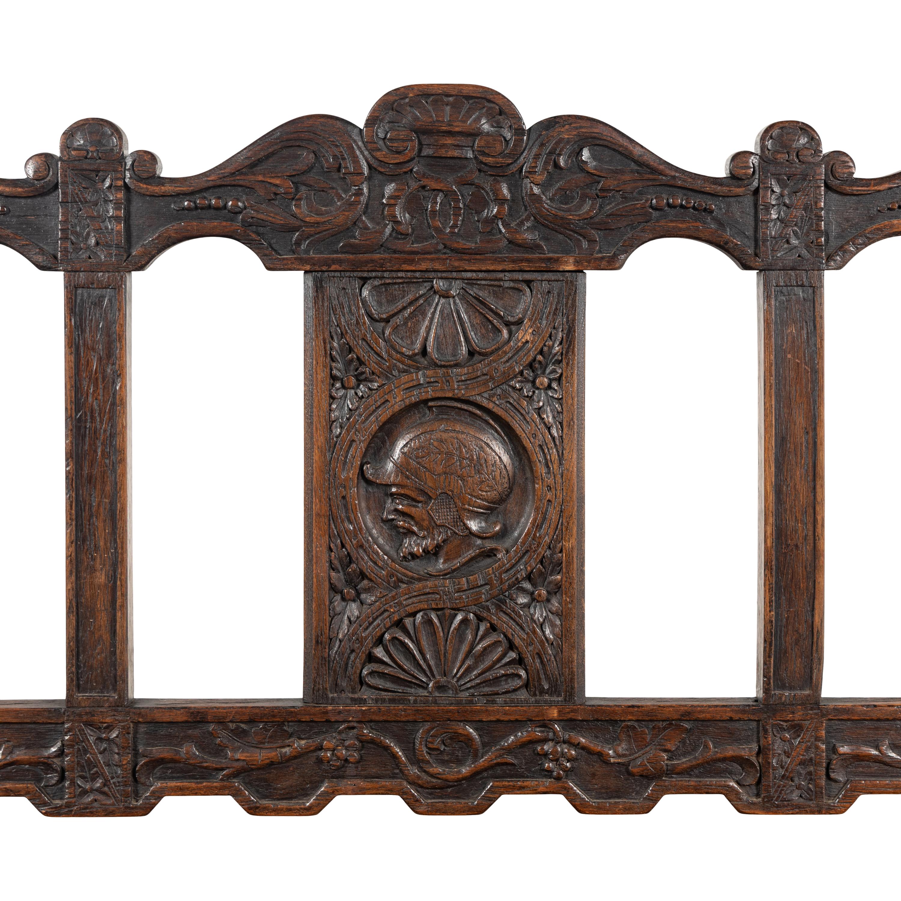 A Continental Carved Oak Hall Bench