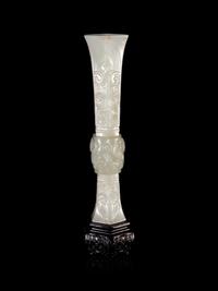A Carved White Jade Gu Vase