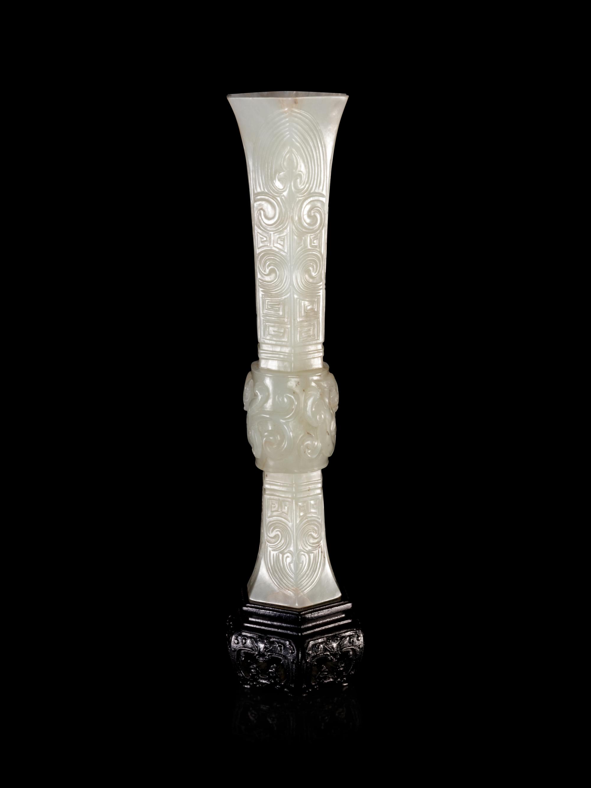 A Carved White Jade Gu Vase