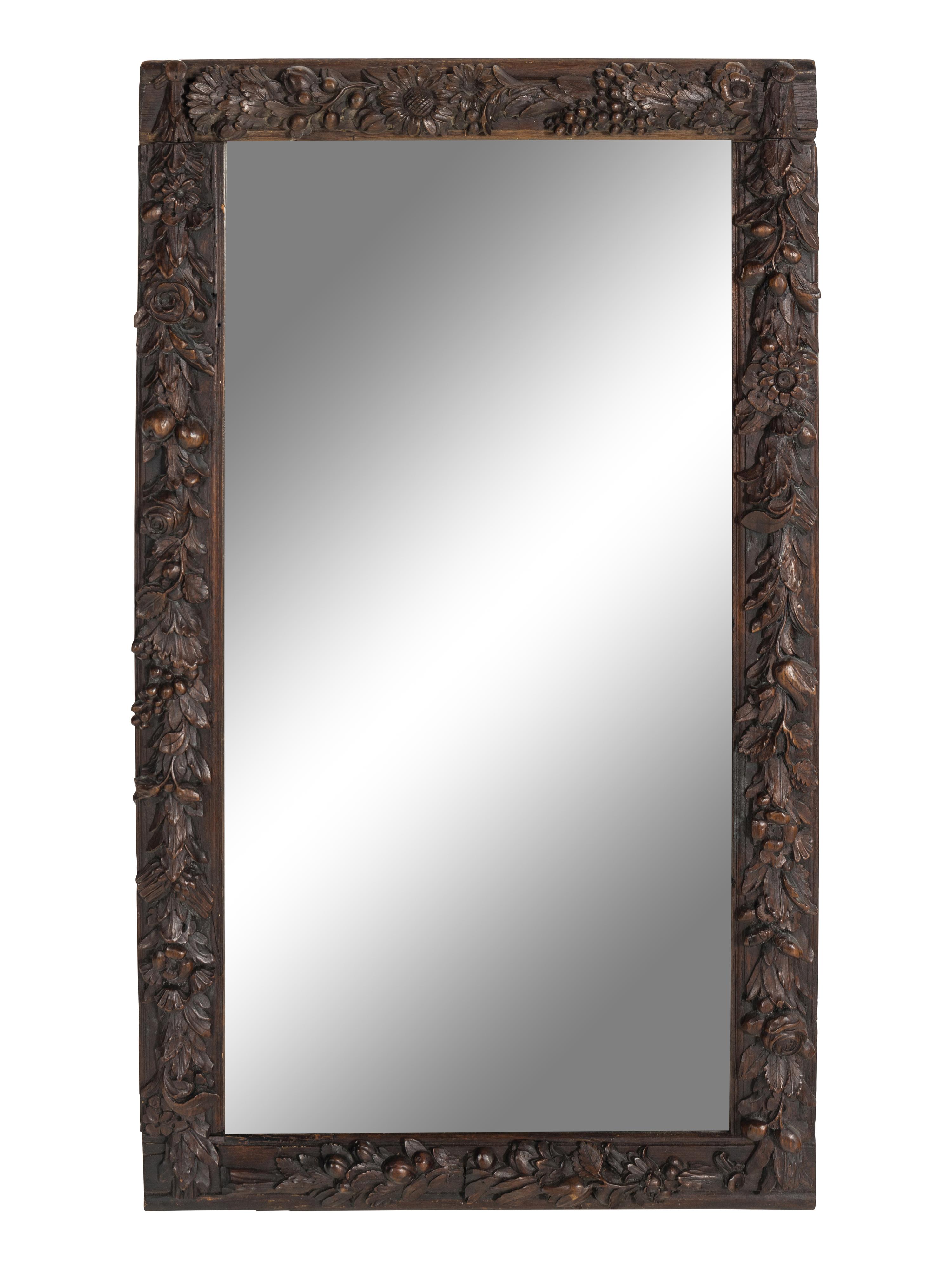 A Carved Oak Grapevine Motif Mirror