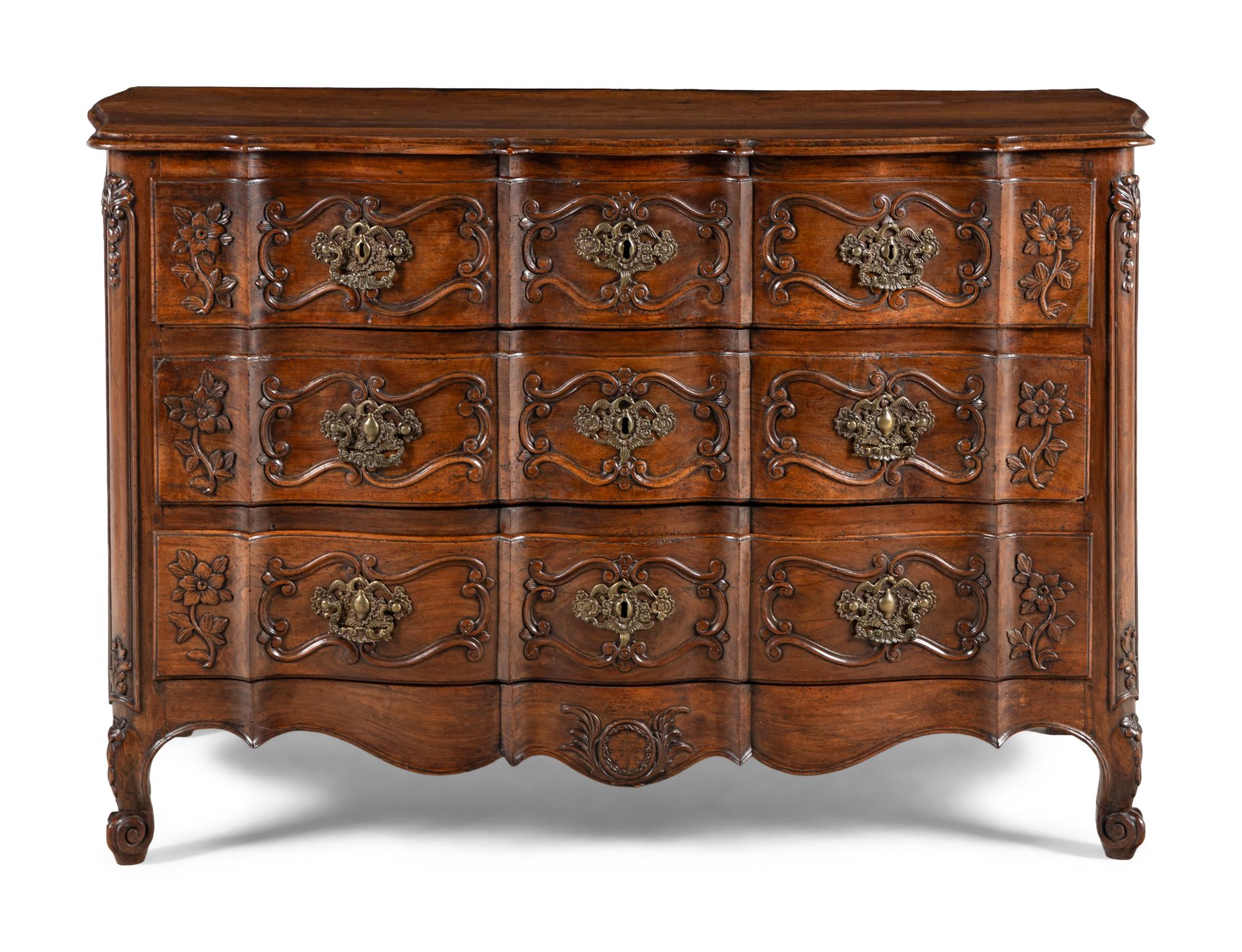 A Louis XV Walnut Serpentine Front Commode