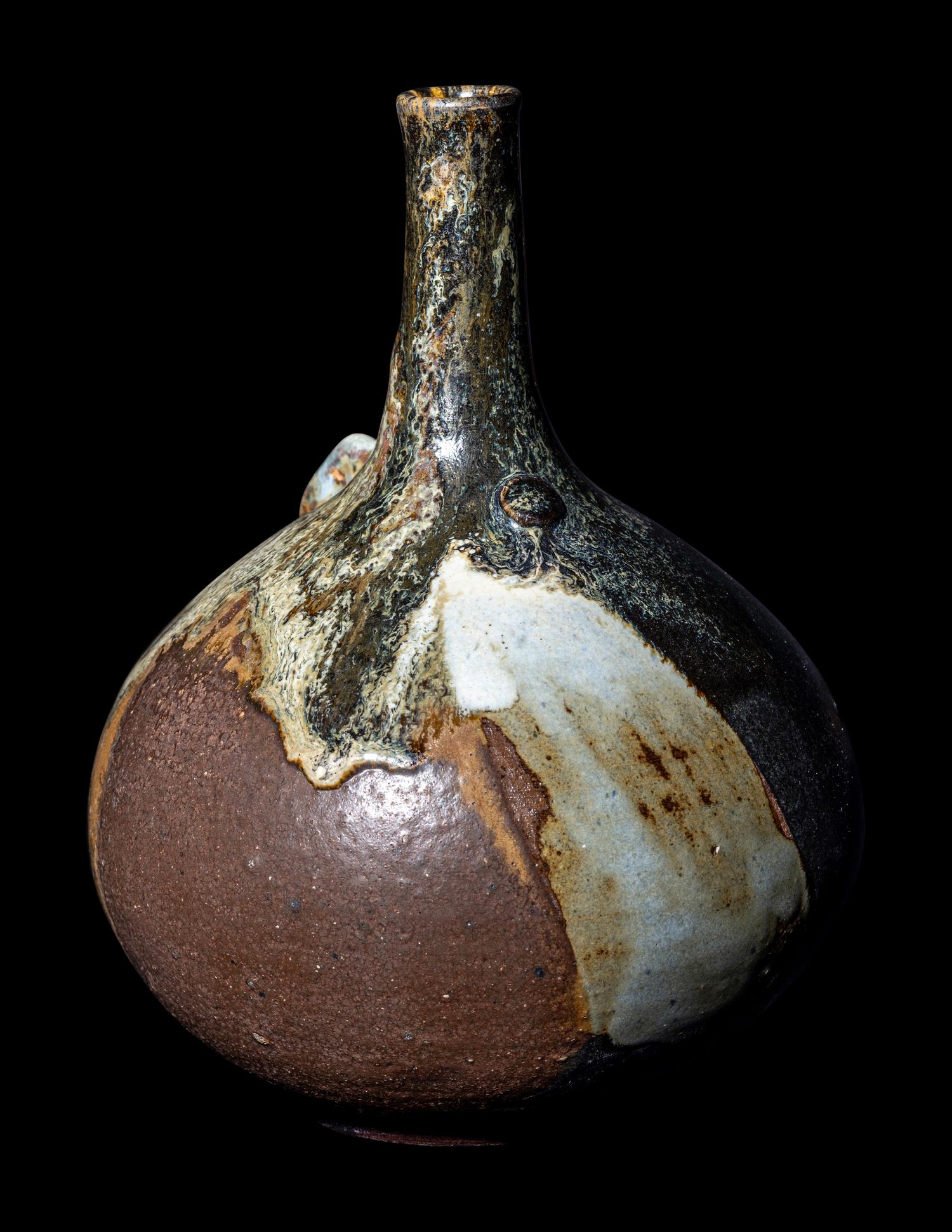 A Japanese Dark Brown Glazed Stoneware Bottle Vase