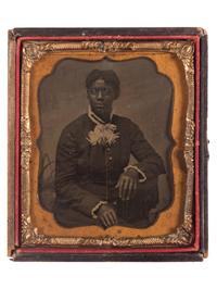 [AFRICAN AMERICANA] -- [EARLY PHOTOGRAPHY]. A group of 3 photographs of African American subjects, incl. tintypes and brooch.