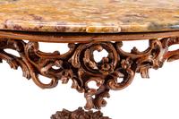 An Italian Rococo Carved Walnut Marble-Top Console Table