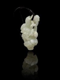 A Carved Jade Toggle Length 2 1/2 inches.