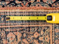 A Persian Senneh Wool Rug