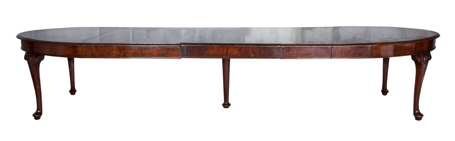 A George III Mahogany Dining Table Height 30 1/2 x width 66 (extending to 138 with leaves) x depth 37 inches.