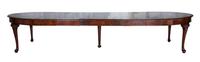 A George III Mahogany Dining Table Height 30 1/2 x width 66 (extending to 138 with leaves) x depth 37 inches.