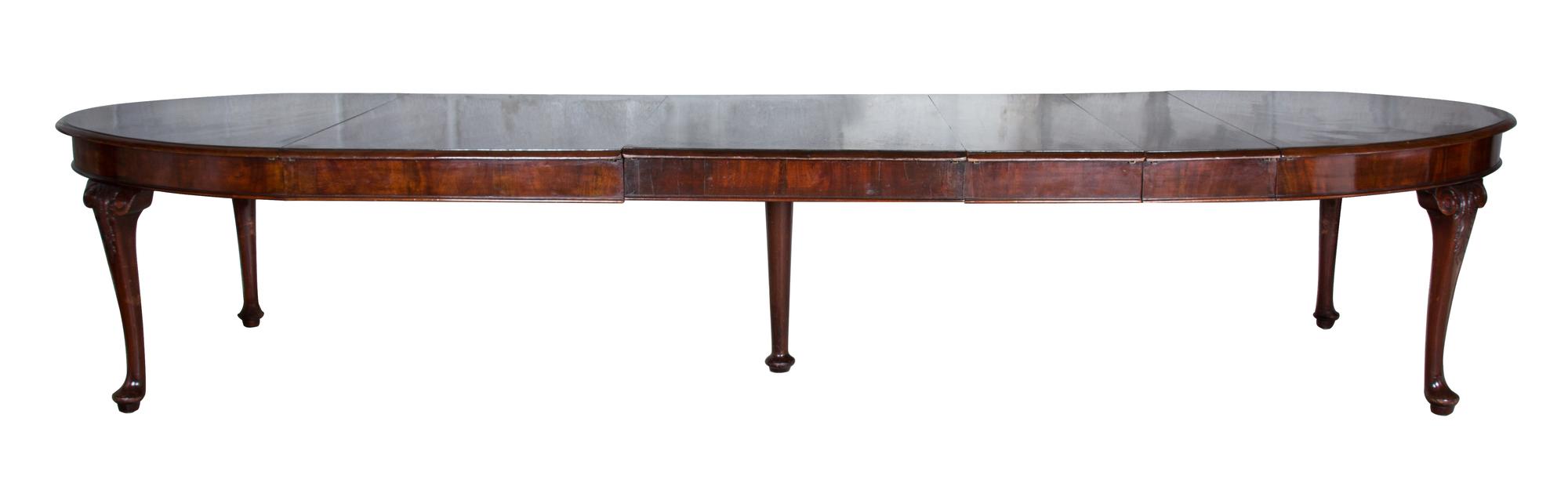 A George III Mahogany Dining Table Height 30 1/2 x width 66 (extending to 138 with leaves) x depth 37 inches.