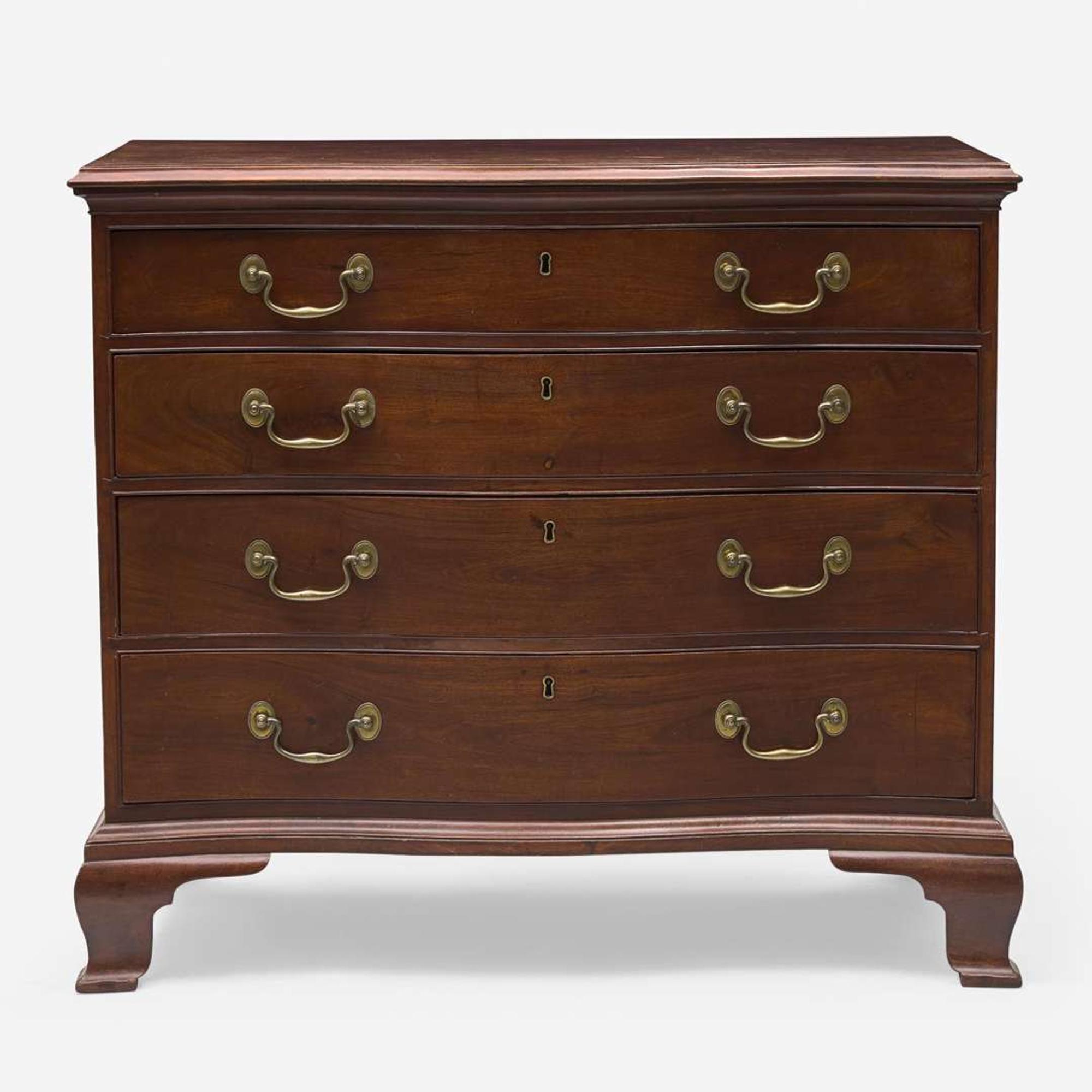 A Chippendale carved serpentine mahogany chest of drawers Possibly Rhode Island, late 18th century