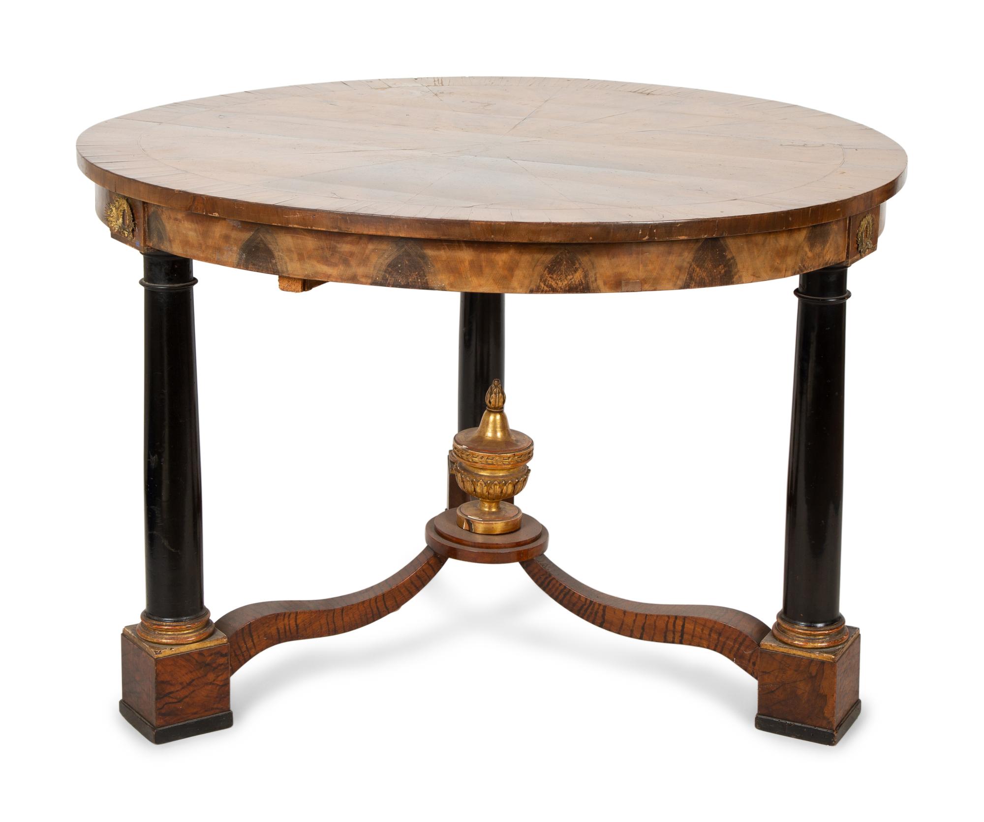 An Empire Style Parcel Ebonized Walnut Center Table — 19TH CENTURY