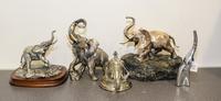 A Group of Five Silvered Metal Elephant Figures Height of tallest 9 1/2 inches.