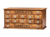 A Twelve Drawer Crowley's Needles Advertising Cabinet