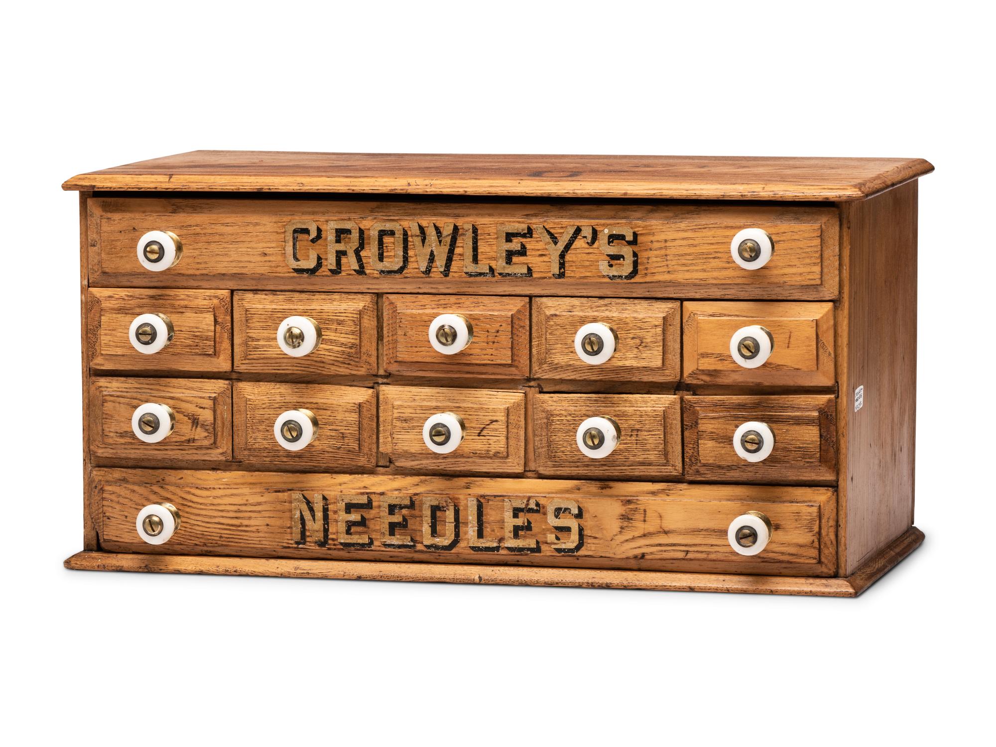 A Twelve Drawer Crowley's Needles Advertising Cabinet