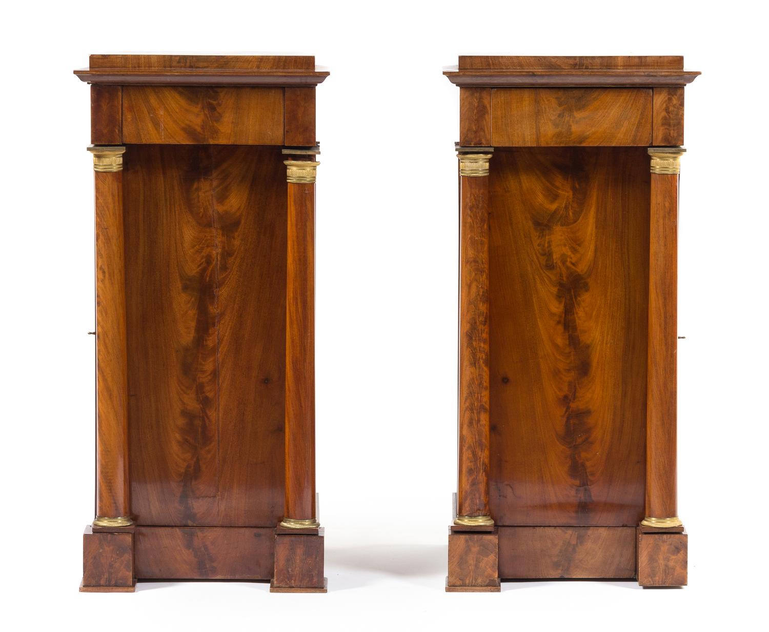A Pair of Empire Mahogany Pedestal Cabinets Height 33 1/2 x width 16 x depth 15 1/2 inches. — 19TH CENTURY