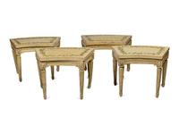 A Set of Four Louis XVI Cream and Polychrome Decorated Curved Window Benches
