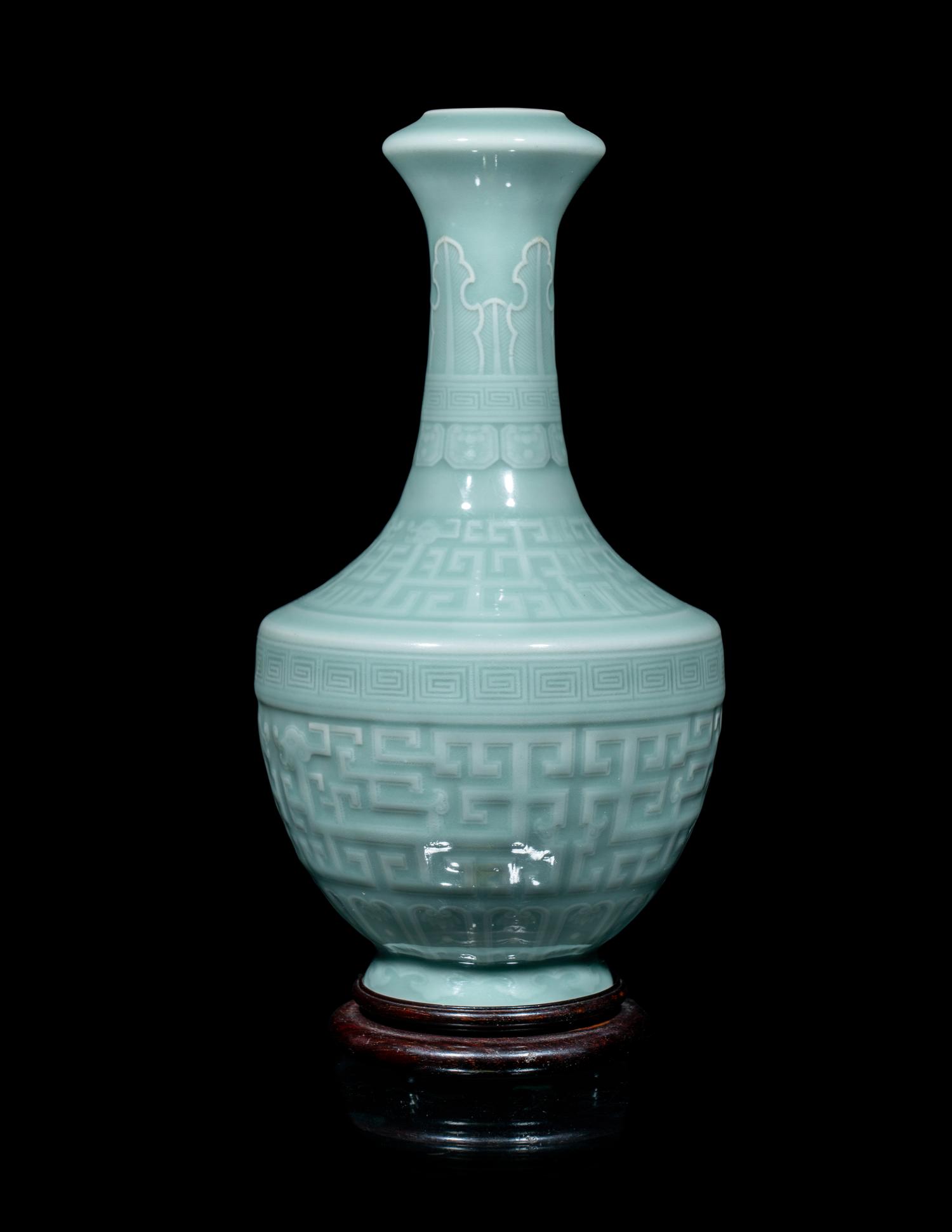 A Chinese Carved Celadon Glazed Porcelain Vase