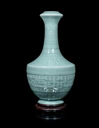 A Chinese Carved Celadon Glazed Porcelain Vase