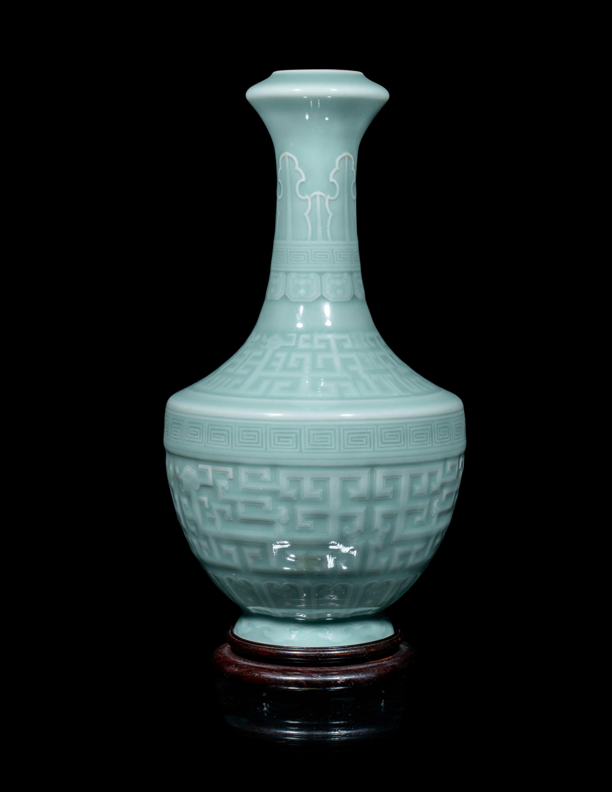 A Chinese Carved Celadon Glazed Porcelain Vase