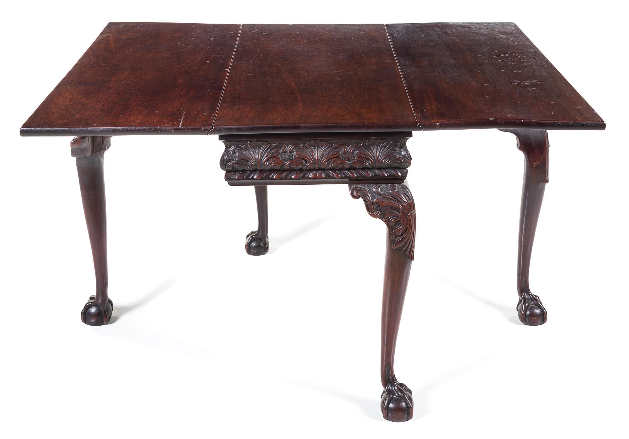 A George II Mahogany Drop-Leaf Table Height 28 x width 36 1/2 x depth 18 inches (closed). — PROBABLY IRISH, 18TH CENTURY