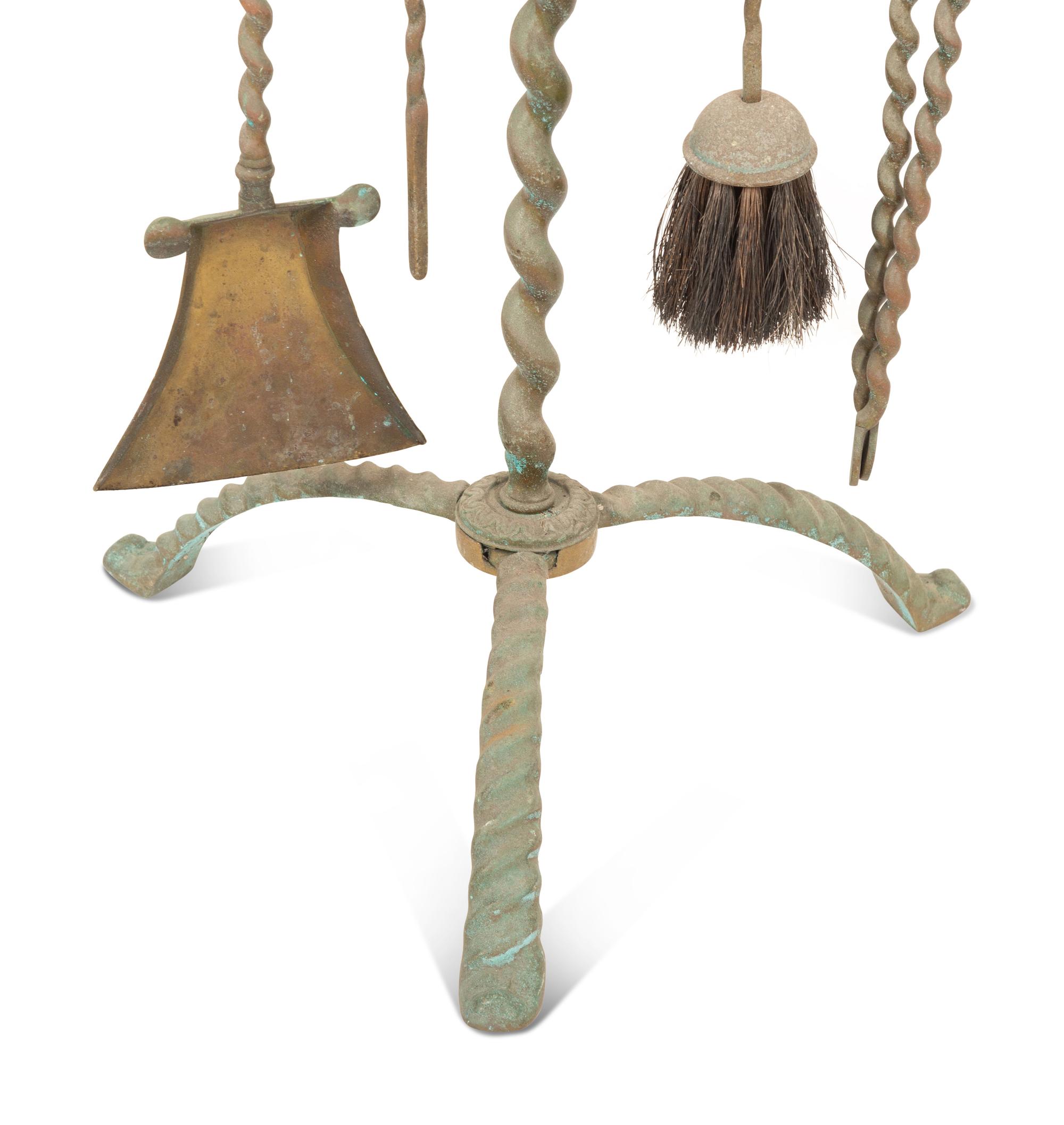 A Mizner Wrought Iron Fireplace Stand with Five Implements