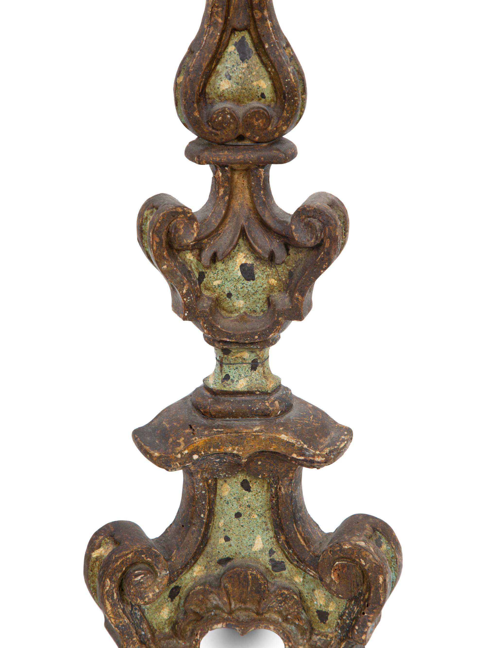 A Pair of Italian Painted and Parcel Gilt Pricket Candlesticks