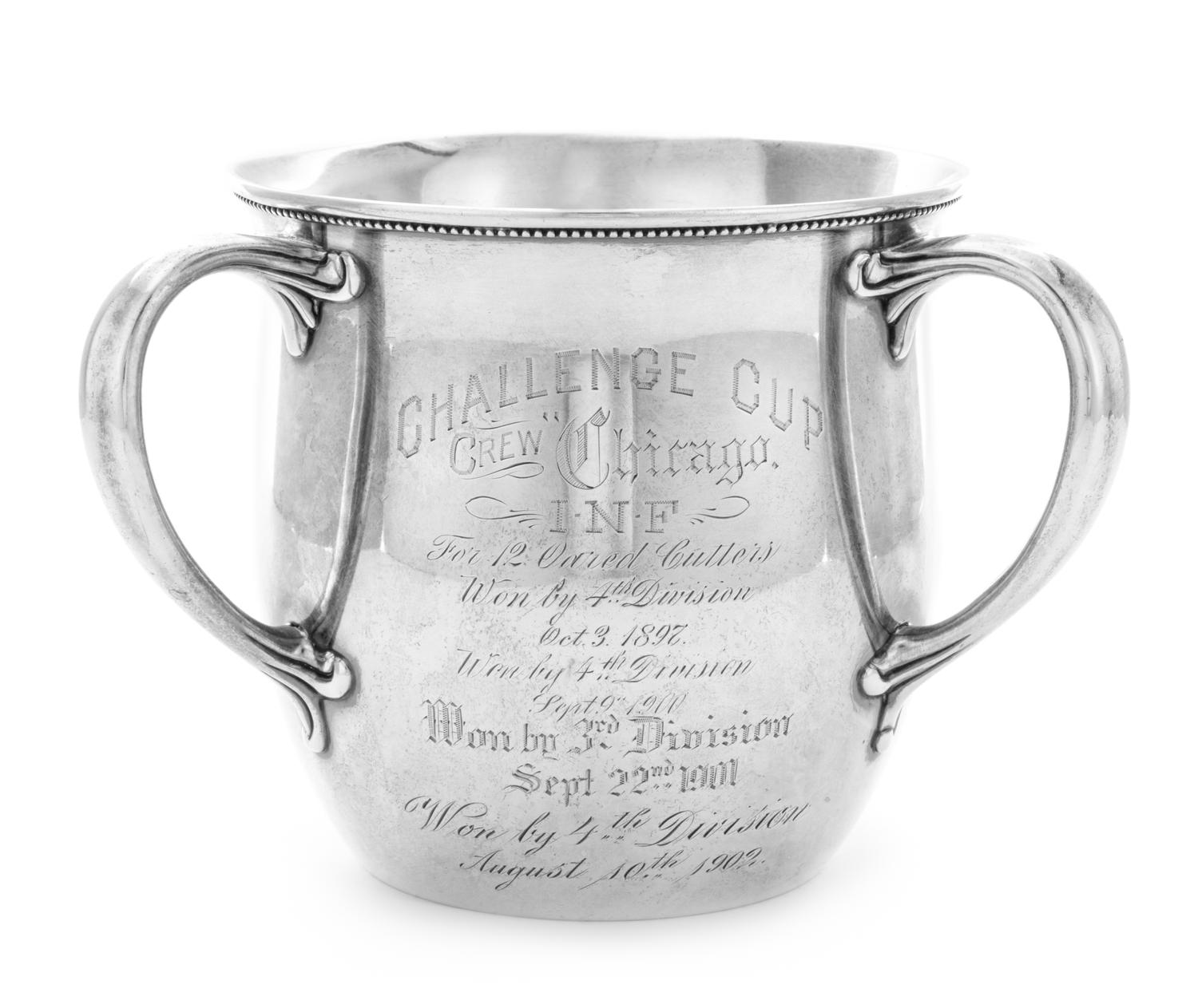An American Silver Trophy Cup of Rowing Interest, Gorham Mfg. Co., Providence, RI, 1897, of Tyg form, the body engraved with a scene of