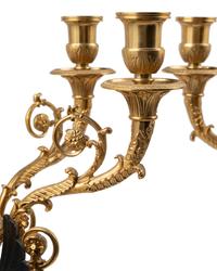 A Pair of Empire Style Gilt and Patinated Metal Six-Light Figural Candelabra