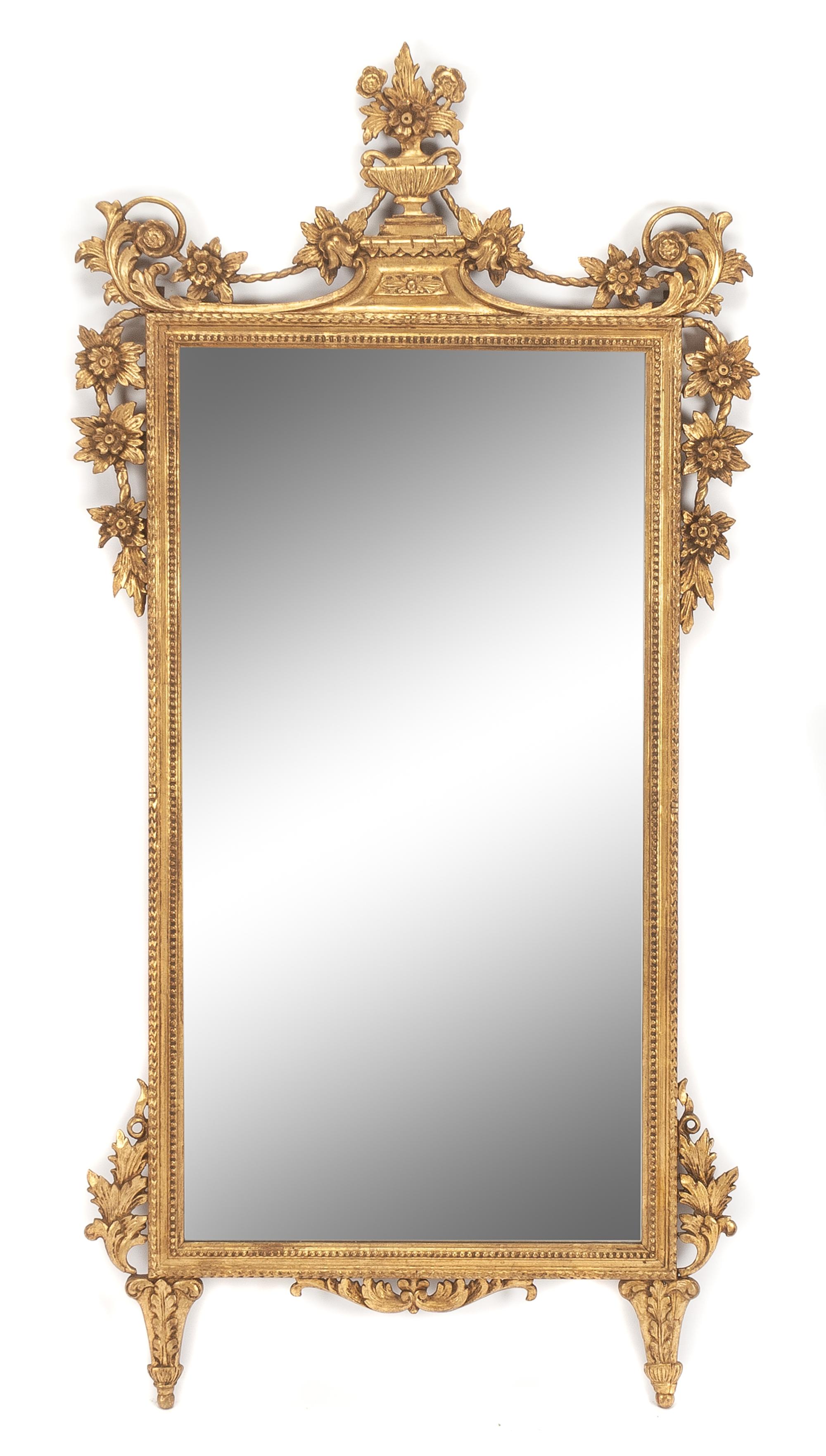 An Italian Giltwood Mirror Height 56 x width 27 1/2 inches. — 19TH CENTURY