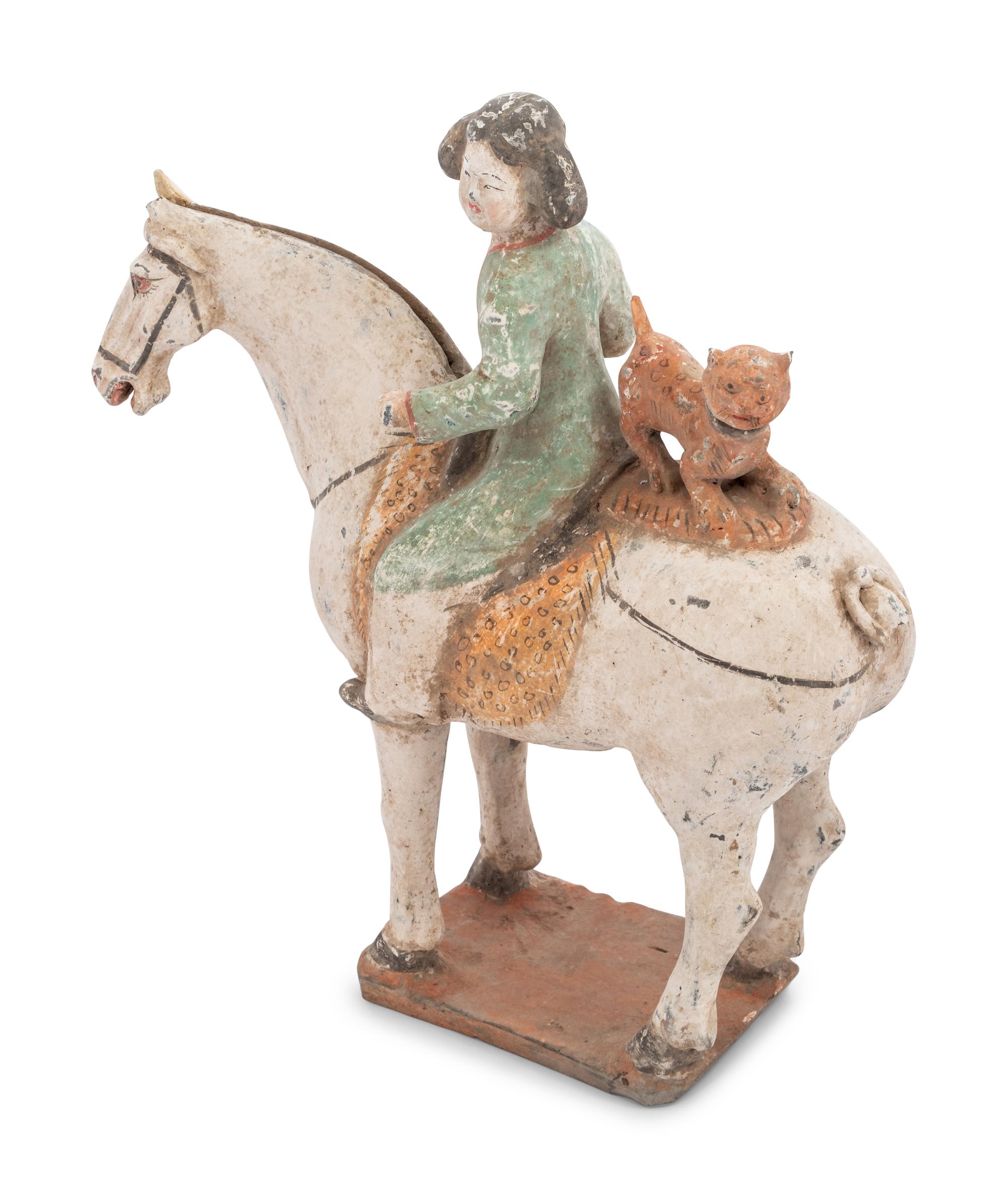A Chinese Painted Pottery Figure of an Equestrienne with a Leopard
